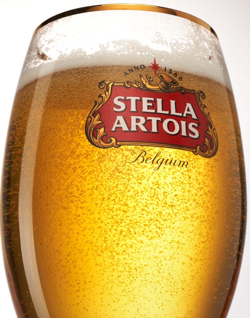 merge Close up of Stella Artois Beer in glass.