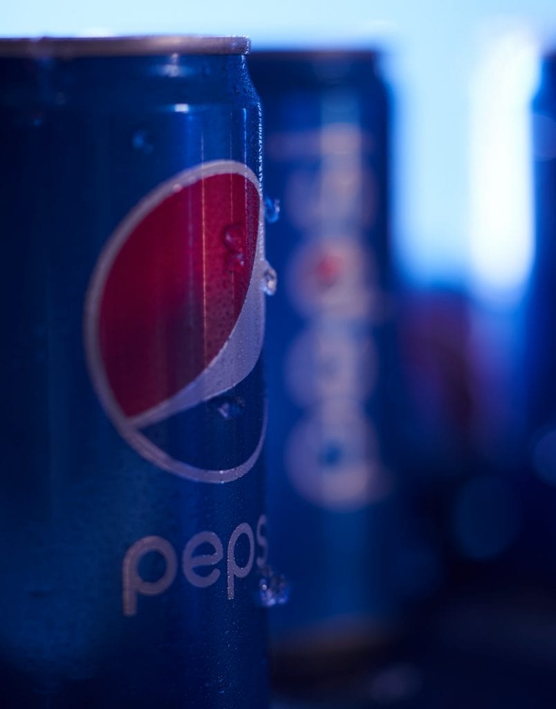 merge close up of Pepsi can with condensation